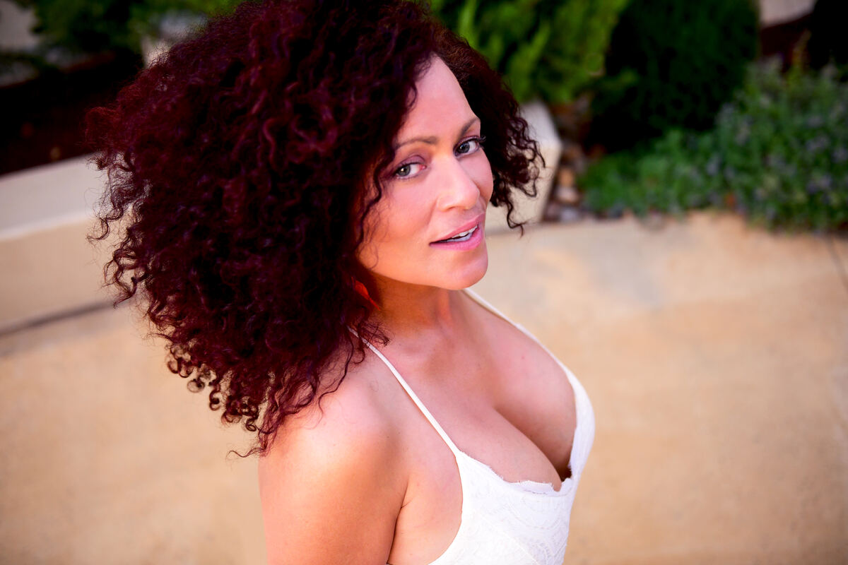 Portrait of a woman with curly auburn hair